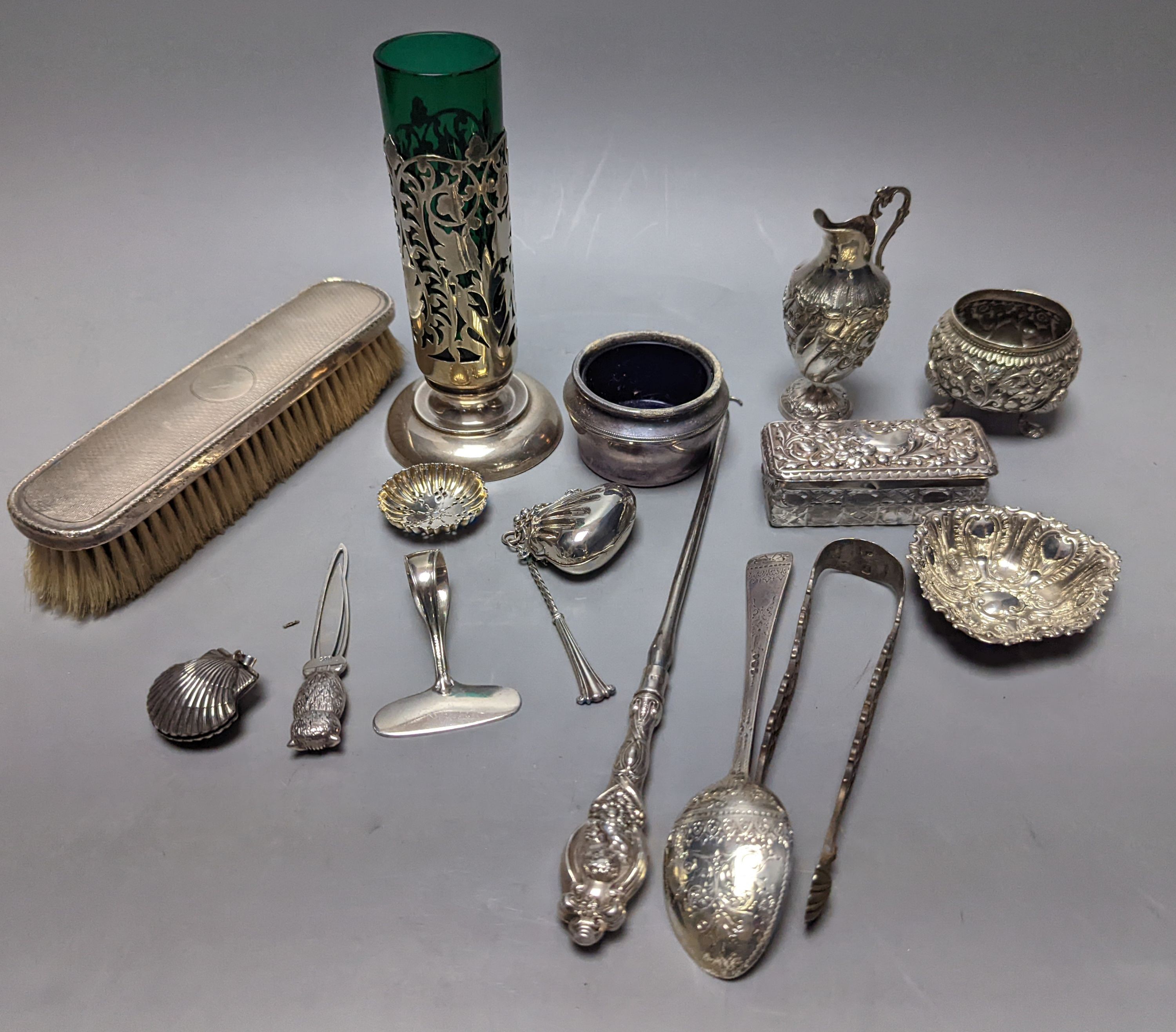 Mixed collectable small silver etc. including silver cream jug, clothes brush, mounted glass posy vase, sugar tongs, owl book mark, spoons and other items.